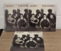 Three copies of Queen 'The works' vinyl album.