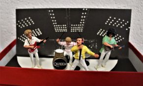 A complete set of Queen miniature metal figures boxed and in excellent condition.
