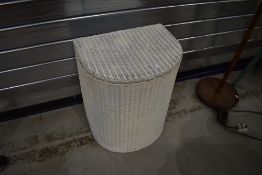 A vintage Lloyd loom demi lune linen basket