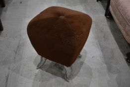 A chrome and dralon footstool of small proportions, width approx 34cm