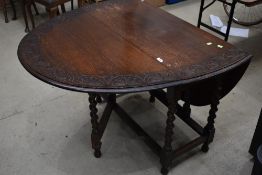 A traditional oak gate leg table
