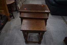 A mid to late 20th Century oak nest of tables