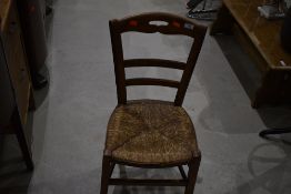 A traditional rush seated bedroom chair