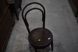 A traditional bentwood chair, evidence of worm to seat