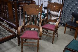 A pair of traditional stained frame carver chairs