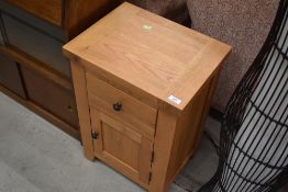 A modern oak bedside cabinet