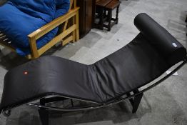 A modernist style chaise longue, having chrome frame, Le Corbusier design, brown leather upholstery
