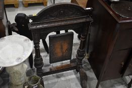 A late 19th/early 20th Century carved oak gong frame, with none original copper tray and beater