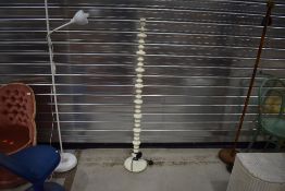 A modern pearl white standard lamp, powder coated metal