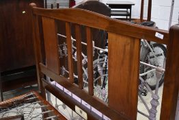 An early 20th Century mahogany bed frame (138cm - 4ft6) , by Staples and Co, with sprung base ,