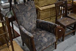 An Art Nouveau mahogany and inlaid armchair, with later upholstery