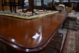 A Victorian mahogany extending dining table, includes winder and two additional leaves, approx.