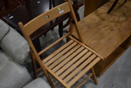 A folding wooden chair