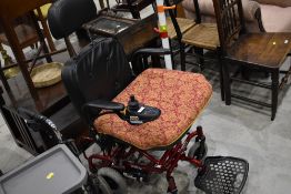 An electric mobility scooter powered by Phisghang and a walking aid