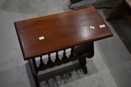 A modern hardwood side table/magazine rack