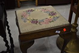 A Queen Anne style tapestry footstool