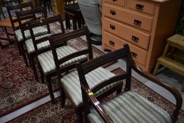 A set of five (four plus one) early 20th Century Regency style mahogany dining chairs