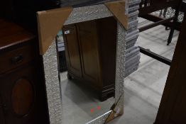 A modern wall mirror , starfish effect, still with packaging, approx 78 x 109cm