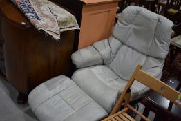 A vintage grey leather Stressless chair and footstool