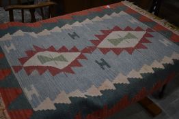 A tribal style rug , Aztec or similar, approx 120 x 93cm
