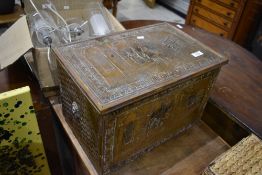 A vintage brass slipper or kindling box