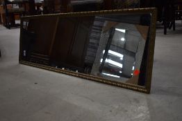 A gilt frame full length wall mirror , approx 105 x 34cm