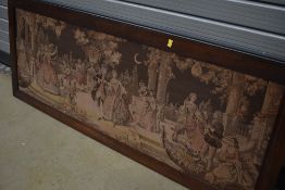 A vintage oak framed tapestry panel, depicting courtship scene, dancing in the moonlight, approx.