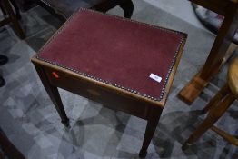 An Edwardian mahogany and inlaid piano stool
