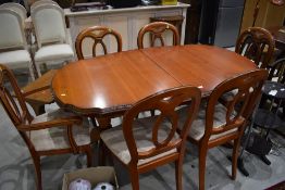 A modern extending dining table good quality (Rossmore or similar) possibly Cherry and six (four