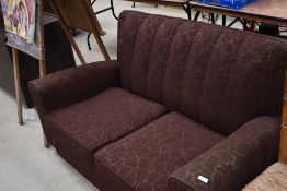 A 1930s settee with original metal casters, finished in brown moquette , good solid frame for a re