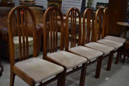 A set of six vintage style archback dining chairs