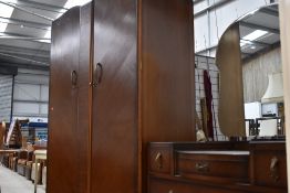 A mid 20th Century oak and ply wardrobe and dressing table