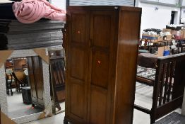 An early 20th Century oak gentlemans wardrobe