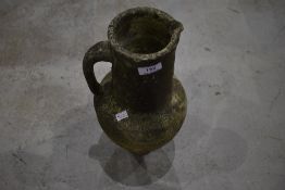 A concrete garden ornament modelled as Grecoromanesque ewer