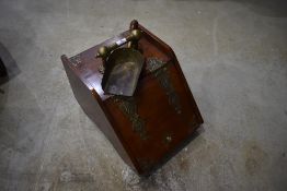 A Victorian mahogany and brass bound coal purdonium