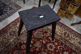 A Victorian carved stool or occasional table