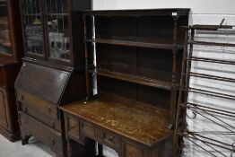 A traditional dark oak dresser of small proportions, width approx. 107cm, height 162cm, depth 45cm