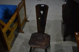 A traditional carved oak spinning/knitting chair