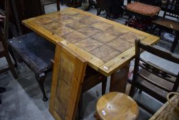 A vintage pine and tile top refectory table, approx. 140 x 79cm , with additional end leaf of 38cm