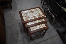 A Danish teak and tile top G plan style nest