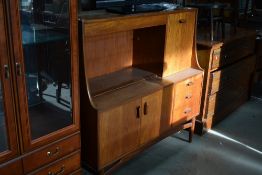 A vintage teak sideboard (possibly G plan) with cocktail or bureau section, width approx. 125cm