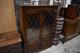A mid to late 20th Century oak display cabinet, possibly Old Charm, width approx. 97cm, height