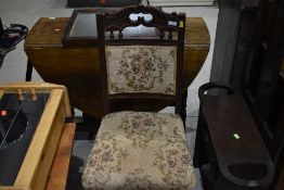 A Victorian mahogany dining chair having overstuffed seat and back and later upholstery