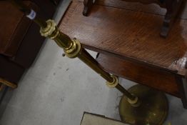 A vintage brass standard lamp