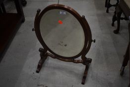 An early 20th Century mahogany toilet mirror (missing top finial)