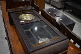 An early 20th Century oak cased wall clock