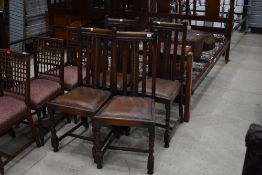 A set of four early 20th Century oak twist leg dining chairs