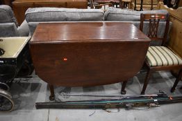 An early to mid 20th Century gateleg dining table, width approx. 110cm