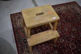 A vintage beech step stool