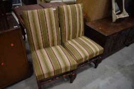 A pair of Period turned frame dining chairs having later upholstery